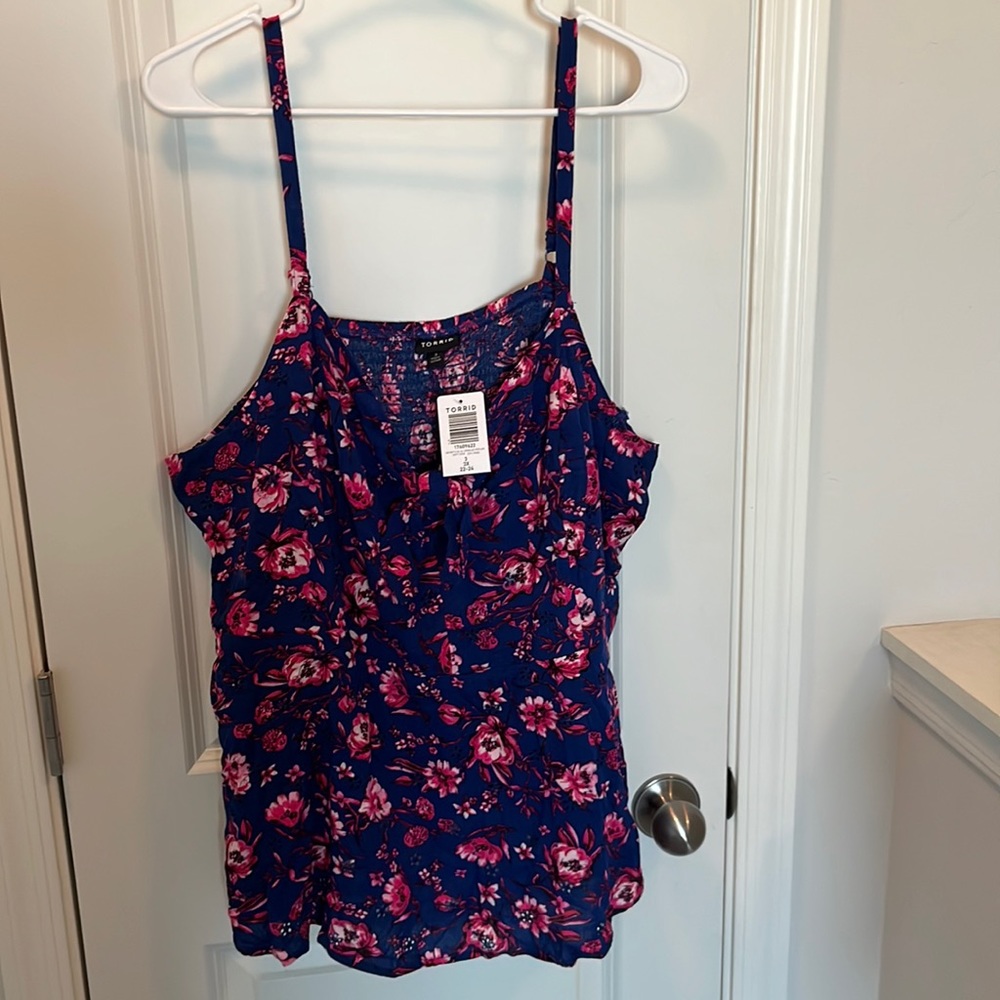 Torrid blouse. Multi color floral spaghetti strap with inner bra lining.